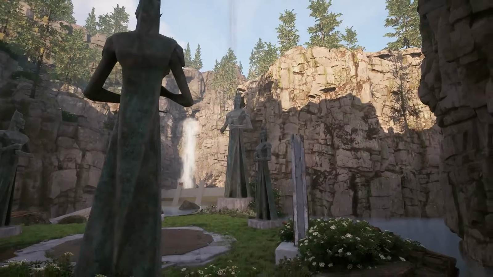 A landmark statue and waterfall in Echoes of Aincrad
